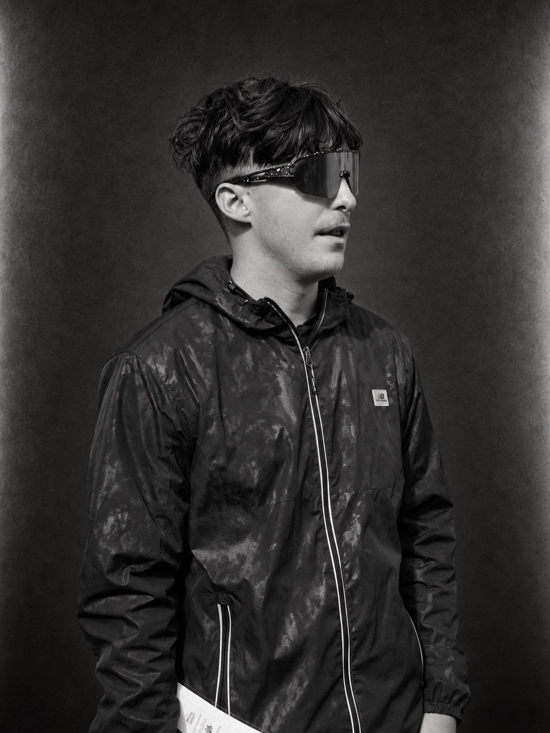Angelo Crippen in a black jacket and wraparound sunglasses